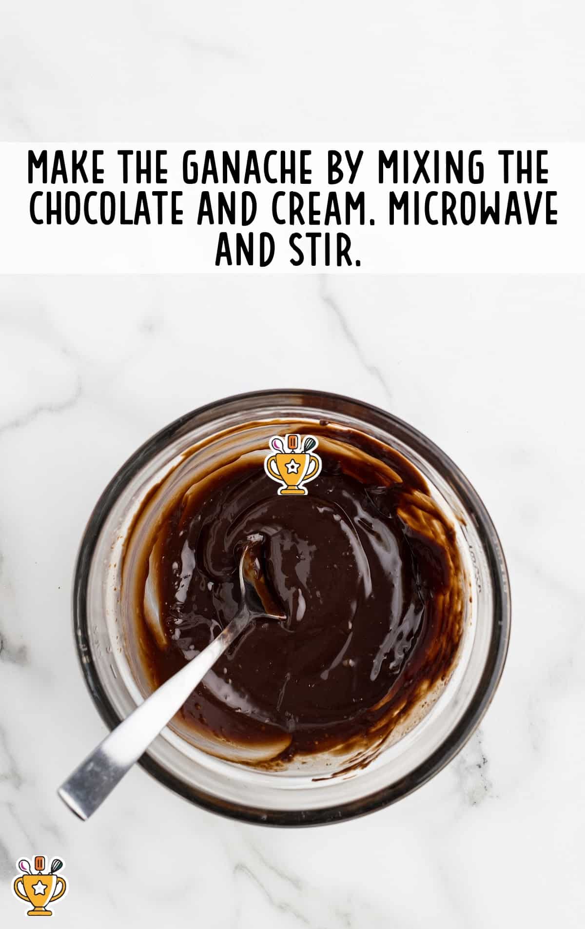 chocolate and cream in a clear bowl and spoon in it