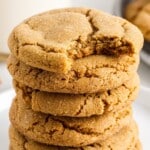 A stack of Molasses Cookies, the one on top with a bite