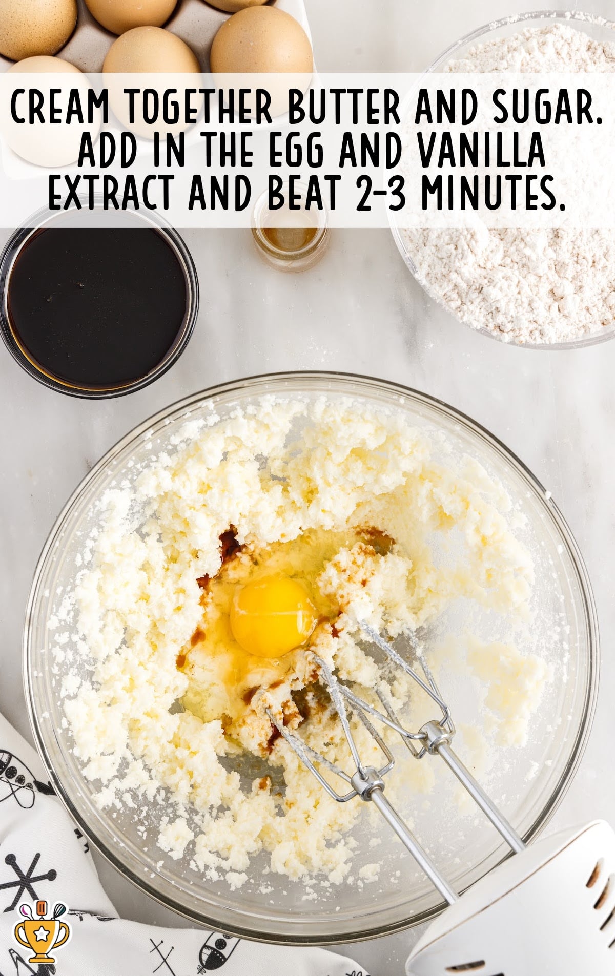 egg, vanilla, butter and sugar added in a bowl and a mixer