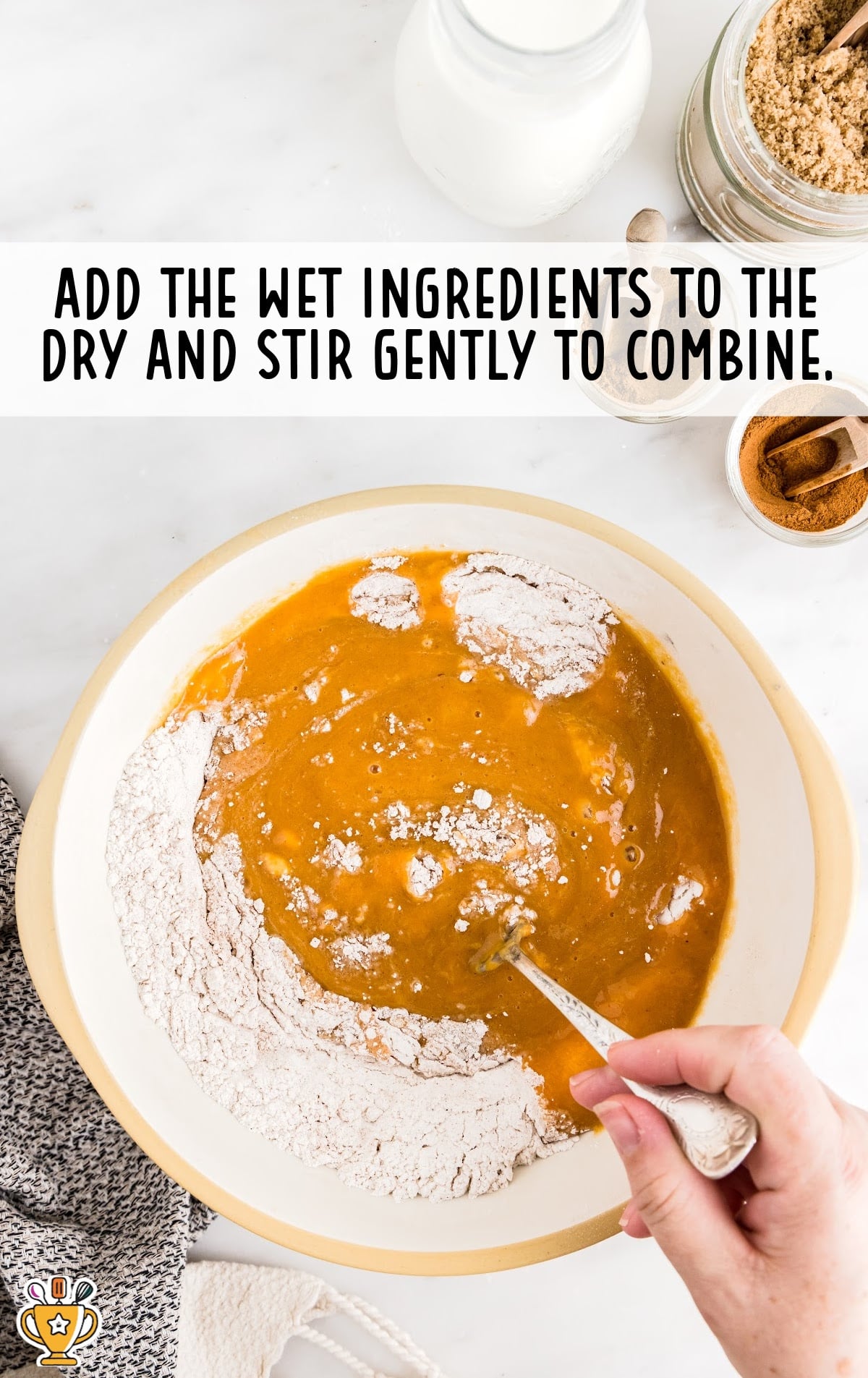 Dry and wet ingredients for making Pumpkin Coffee Cake combined together