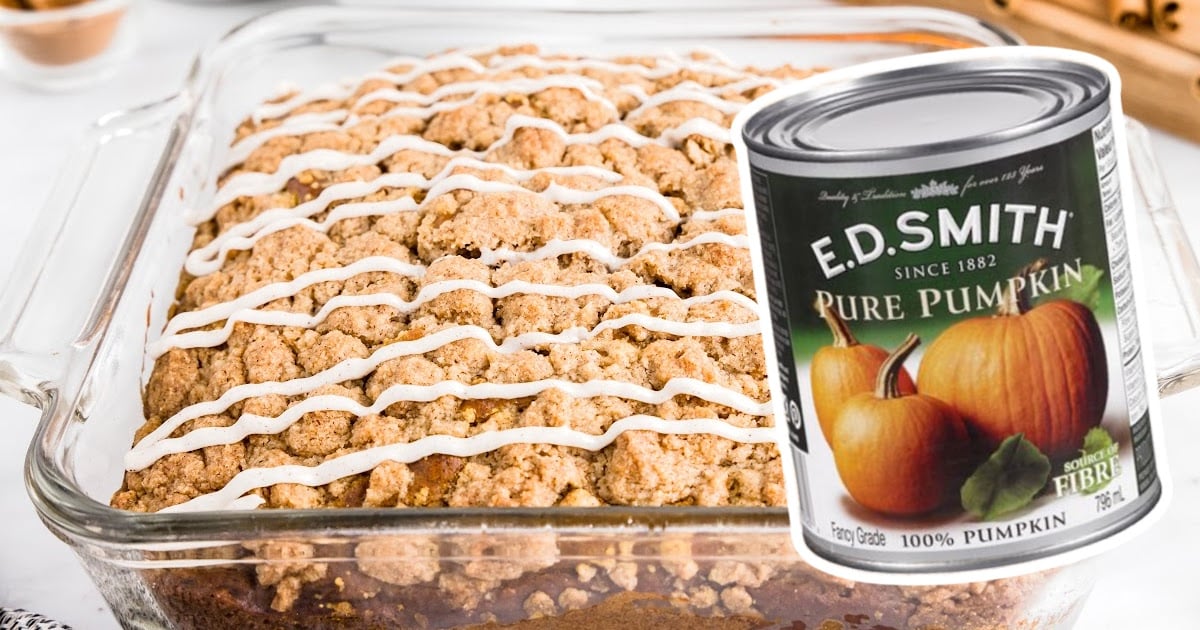 A glass baking pan full of Pumpkin Coffee Cake and pure pumpkin can on the side