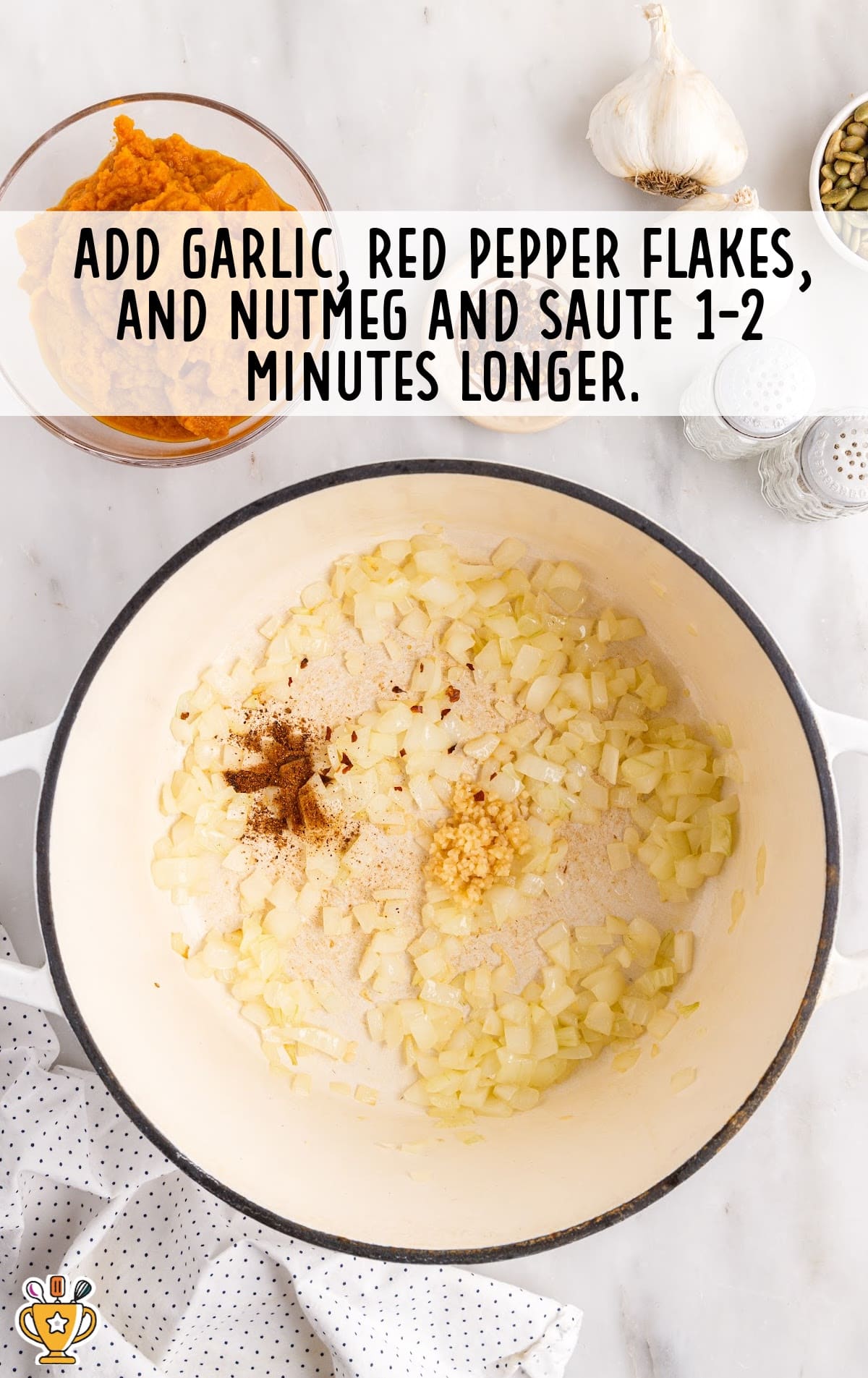 Garlic, red pepper flakes, and nutmeg in a pot