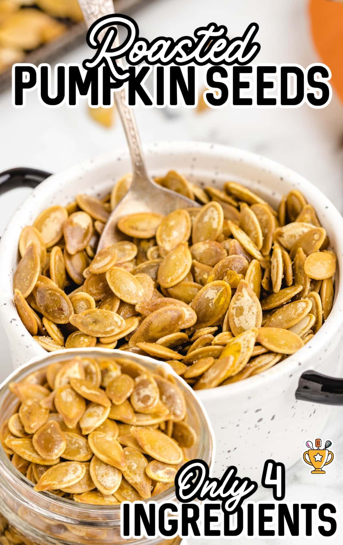 Roasted Pumpkin Seeds in a bowl with a poon in it and in a clear jar
