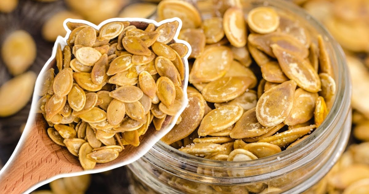 Roasted Pumpkin Seeds in a jar and in a wooden spoon