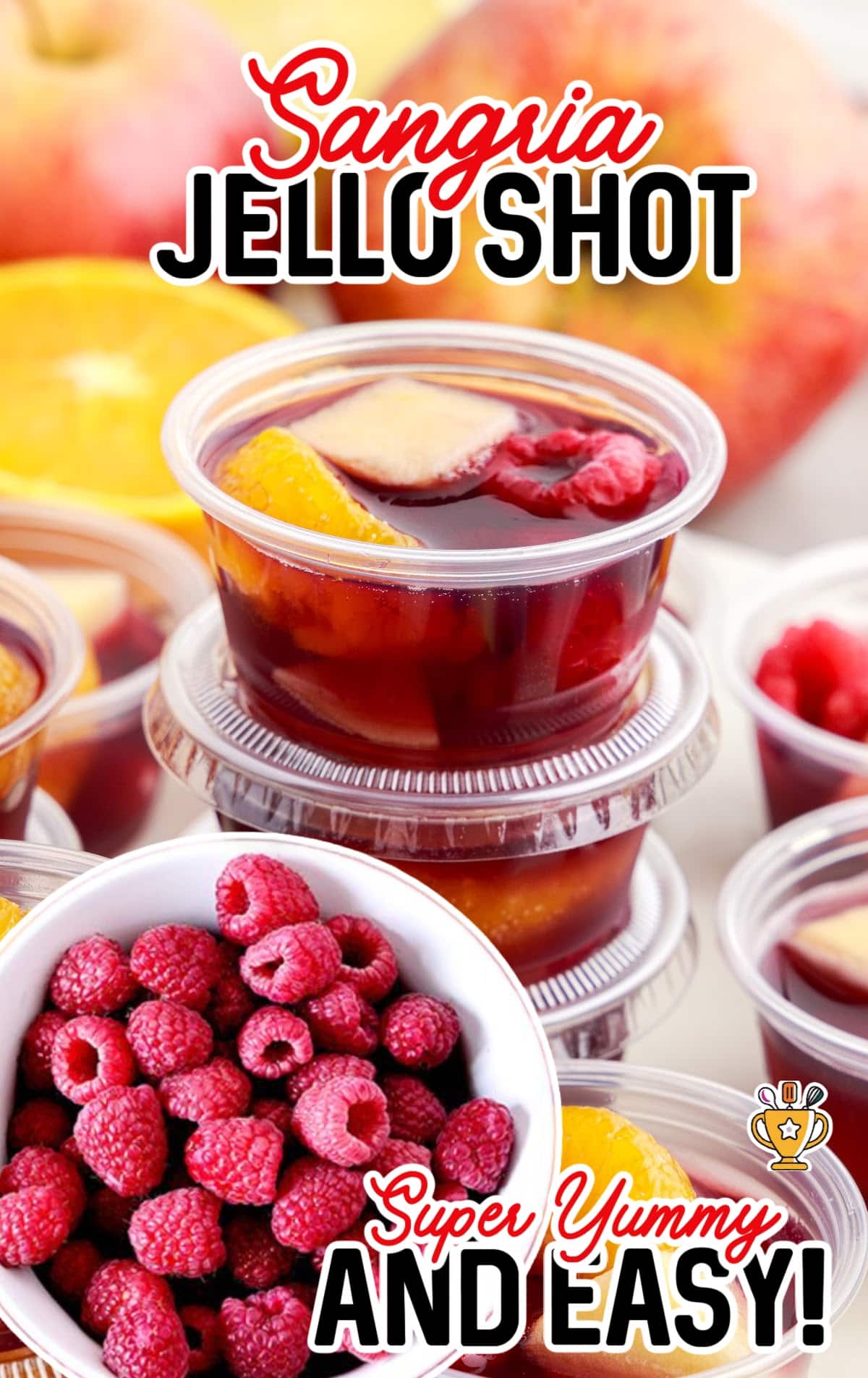 Sangria Jello Shot cups with a bowl of raspberries