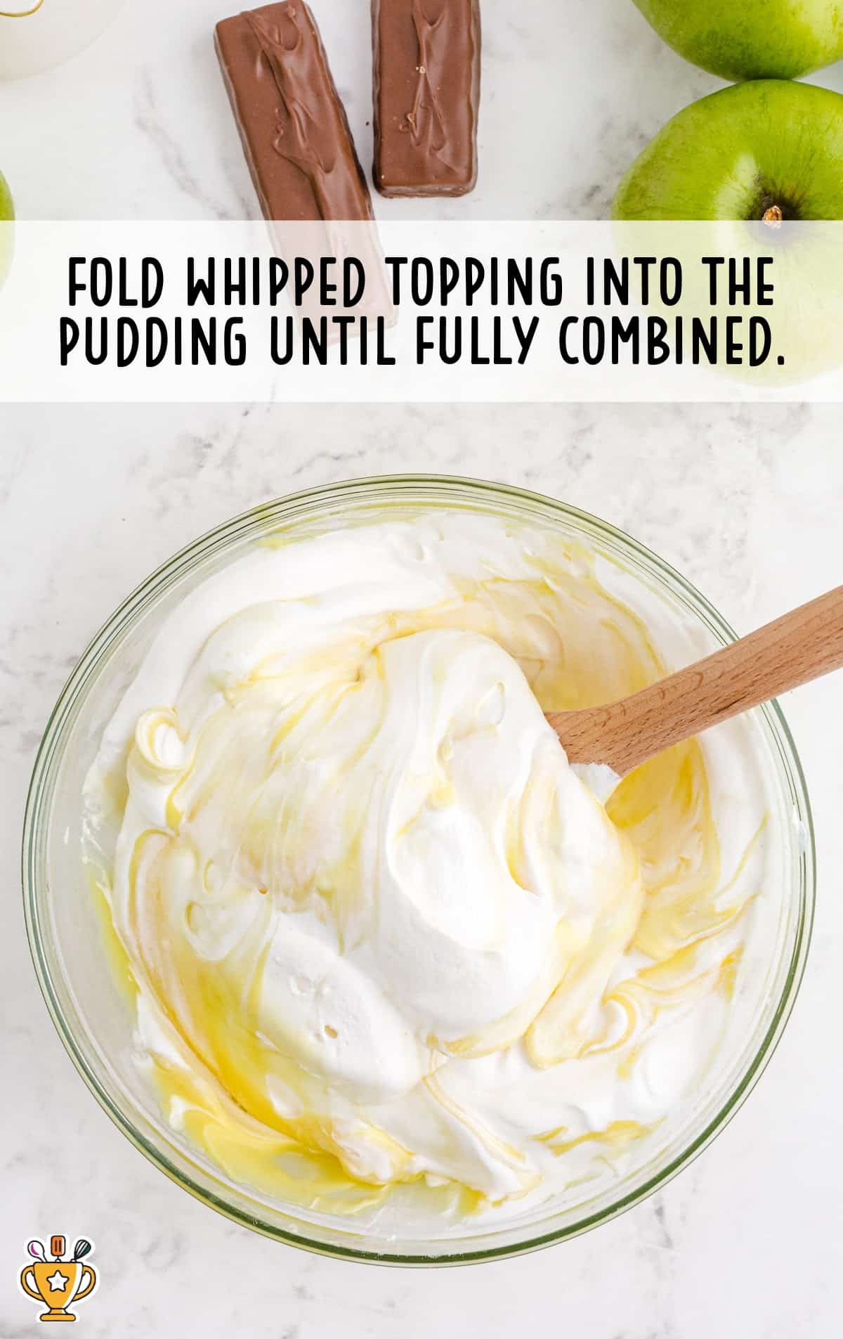 topping and pudding in a bowl with a wooden spoon