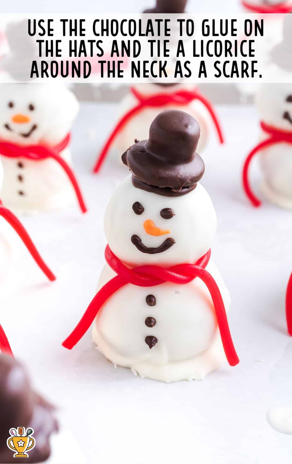 A Snowman Truffle with a hat and a scarf on the neck