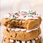 Soft Gingerbread Cookies stacked together the top one with a bite on it