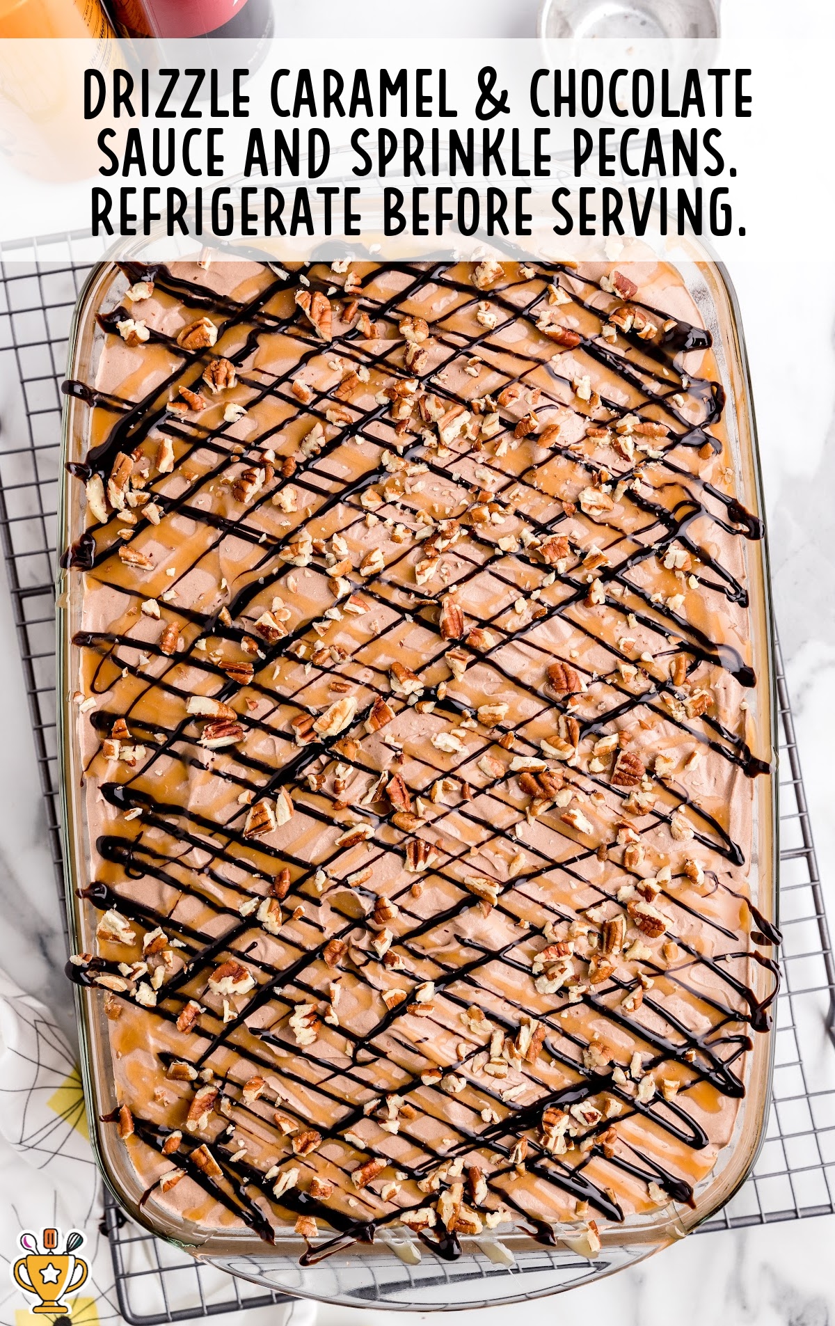 Turtle Poke Cake in a clear baking dish