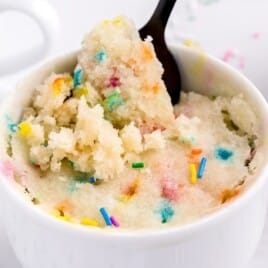 Vanilla Mug Cake in a mug with a spoon