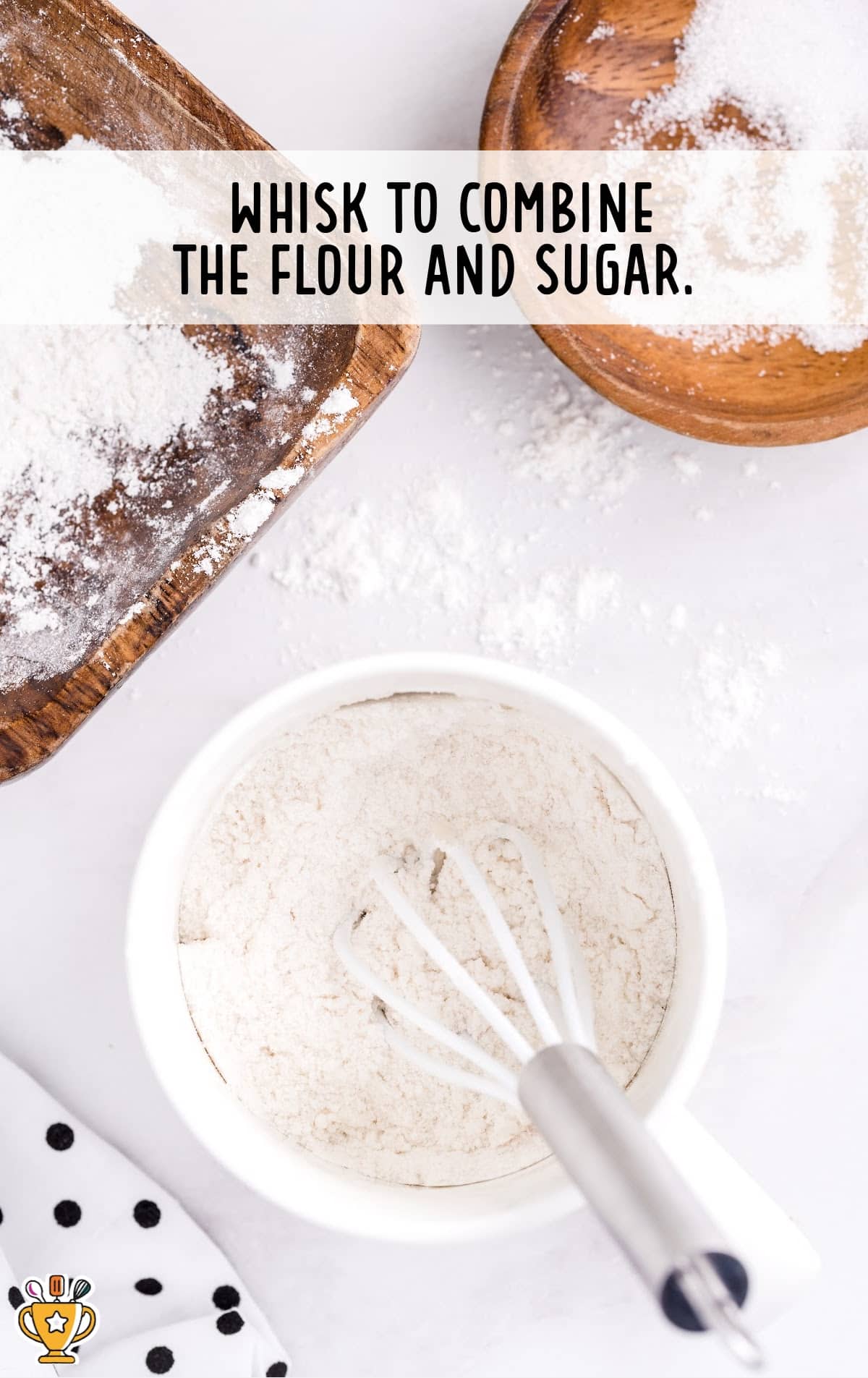 flour and sugar in a bowl with a mixer