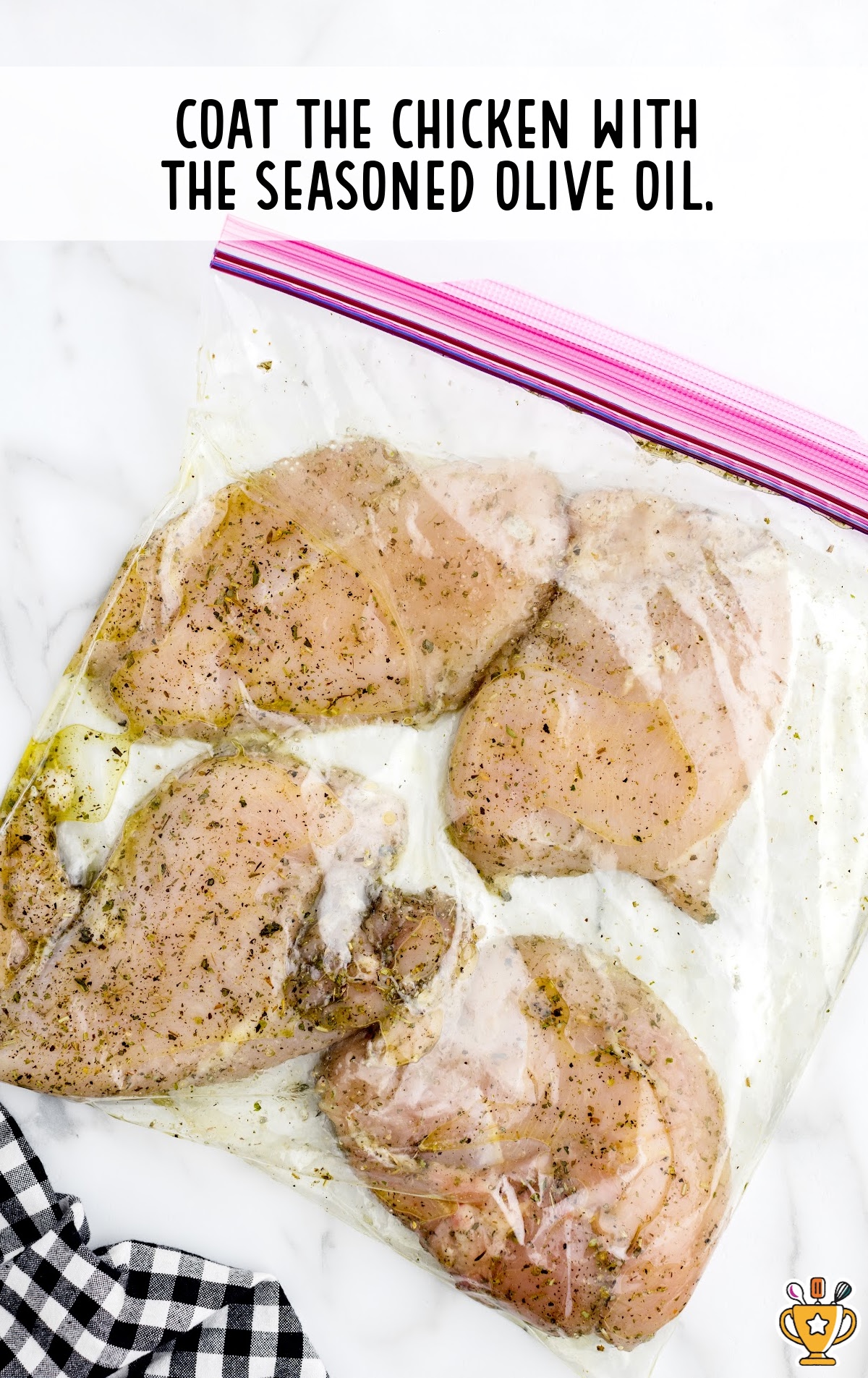 Chicken coated with seasoned olive oil in a zipper bag