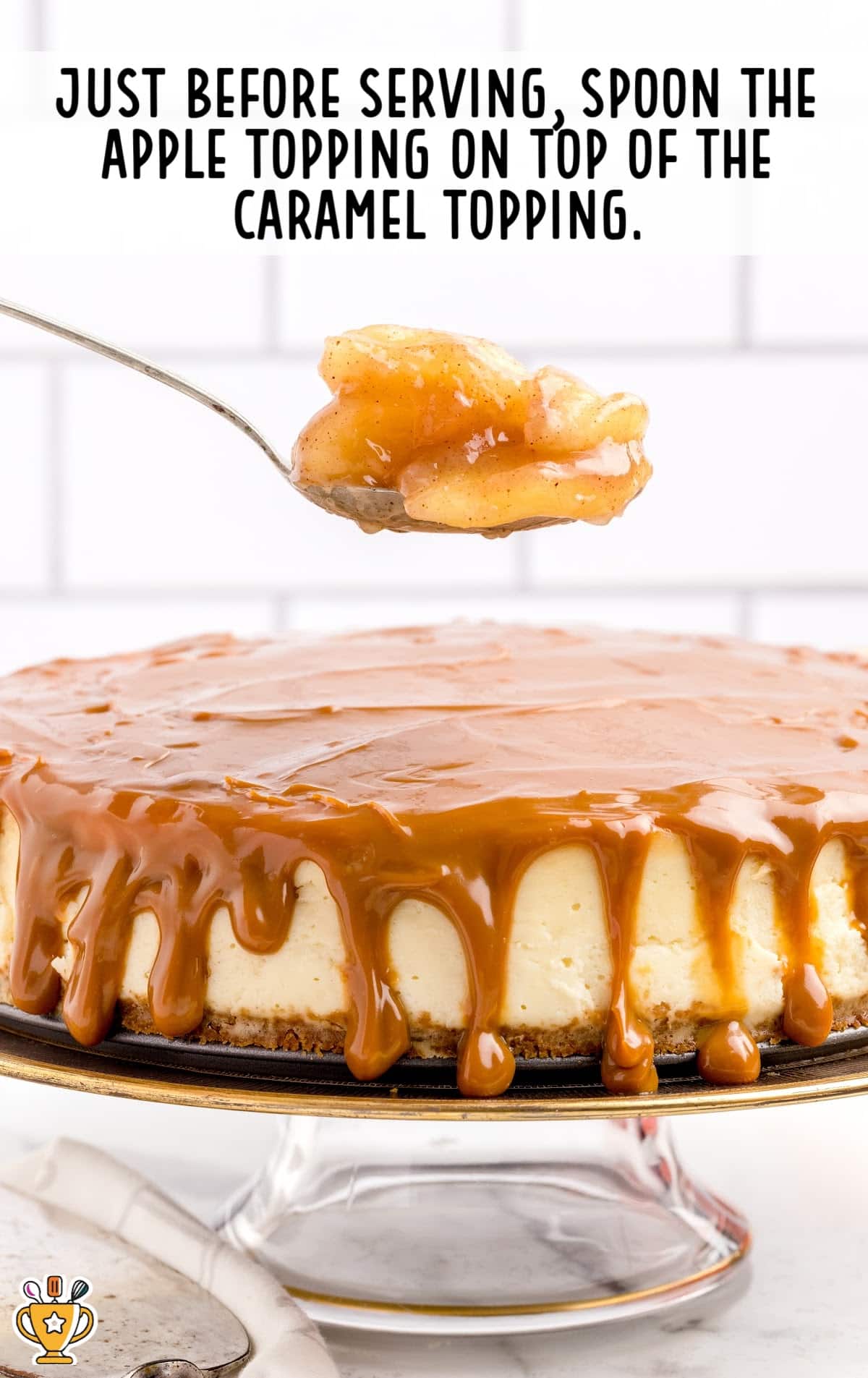 apple topping on a spoon over the Caramel Apple Cheesecake