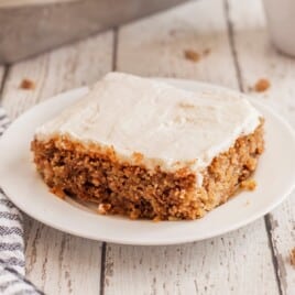 a piece of cake on a white dessert plate