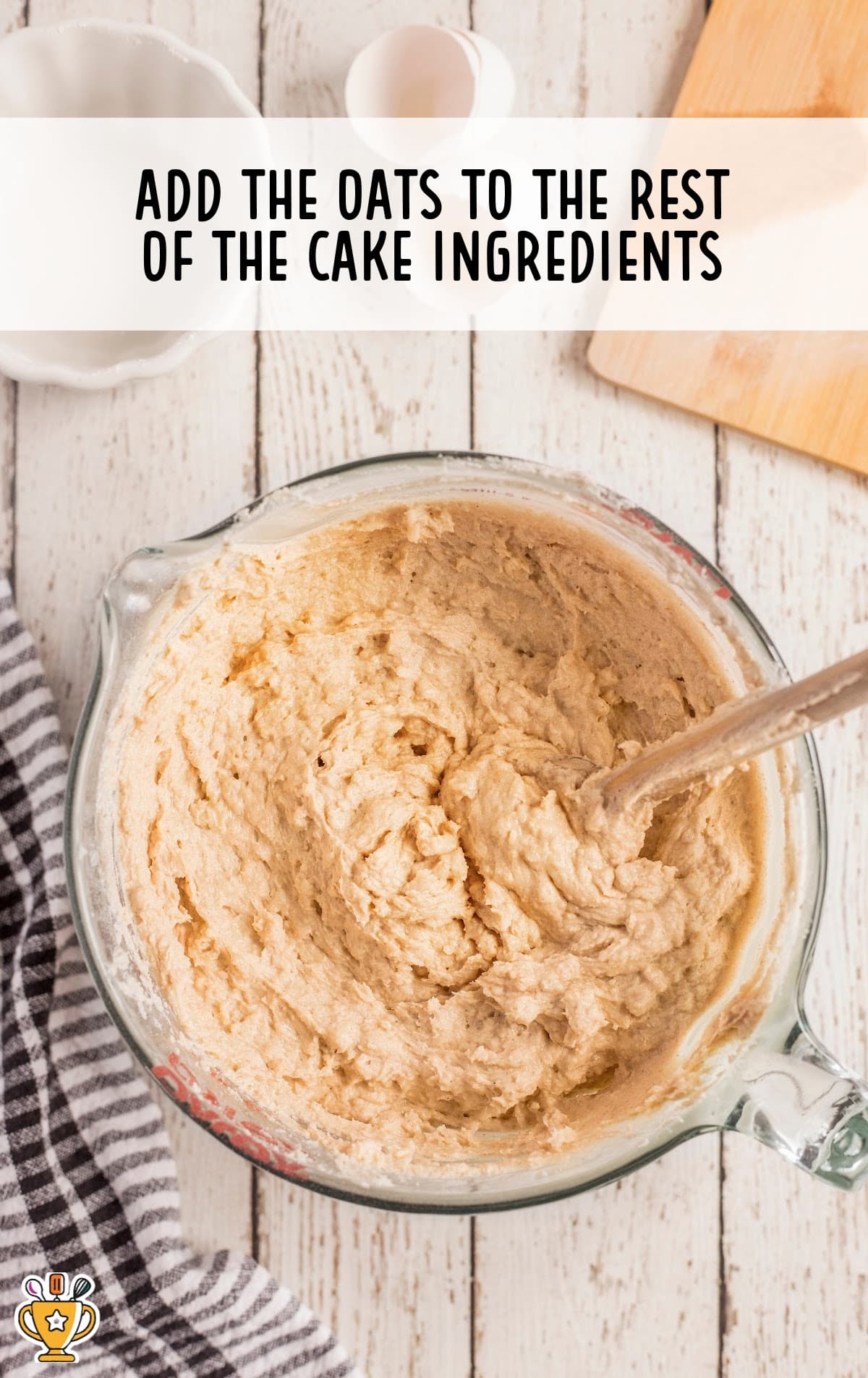 the batter for the cake in a glass mixing bowl.