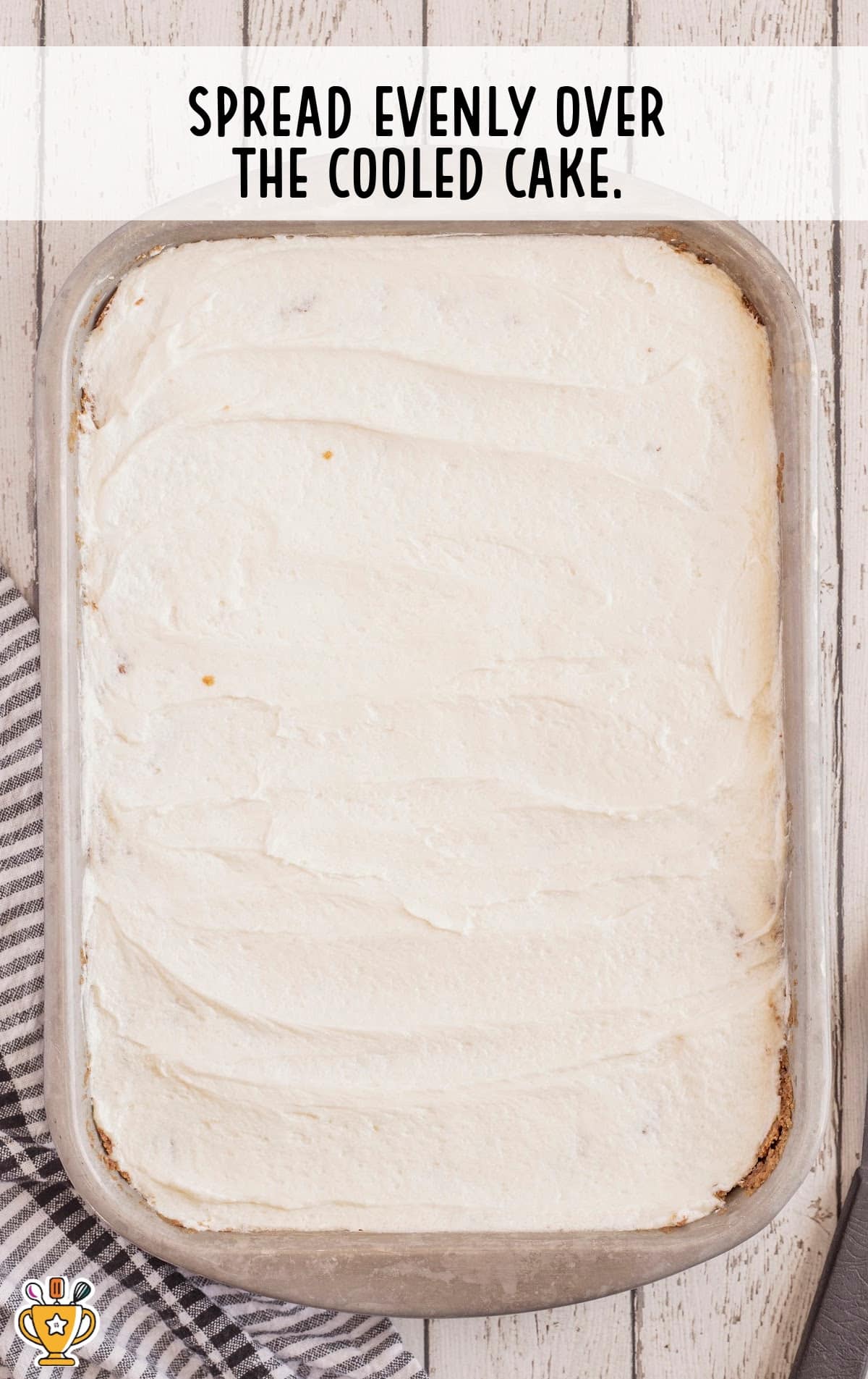 a frosted cake in a baking pan