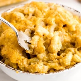 Pumpkin Mac and Cheese in a bowl with a fork in it