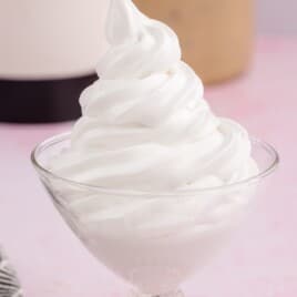 a glass bowl full of 7 minute frosting