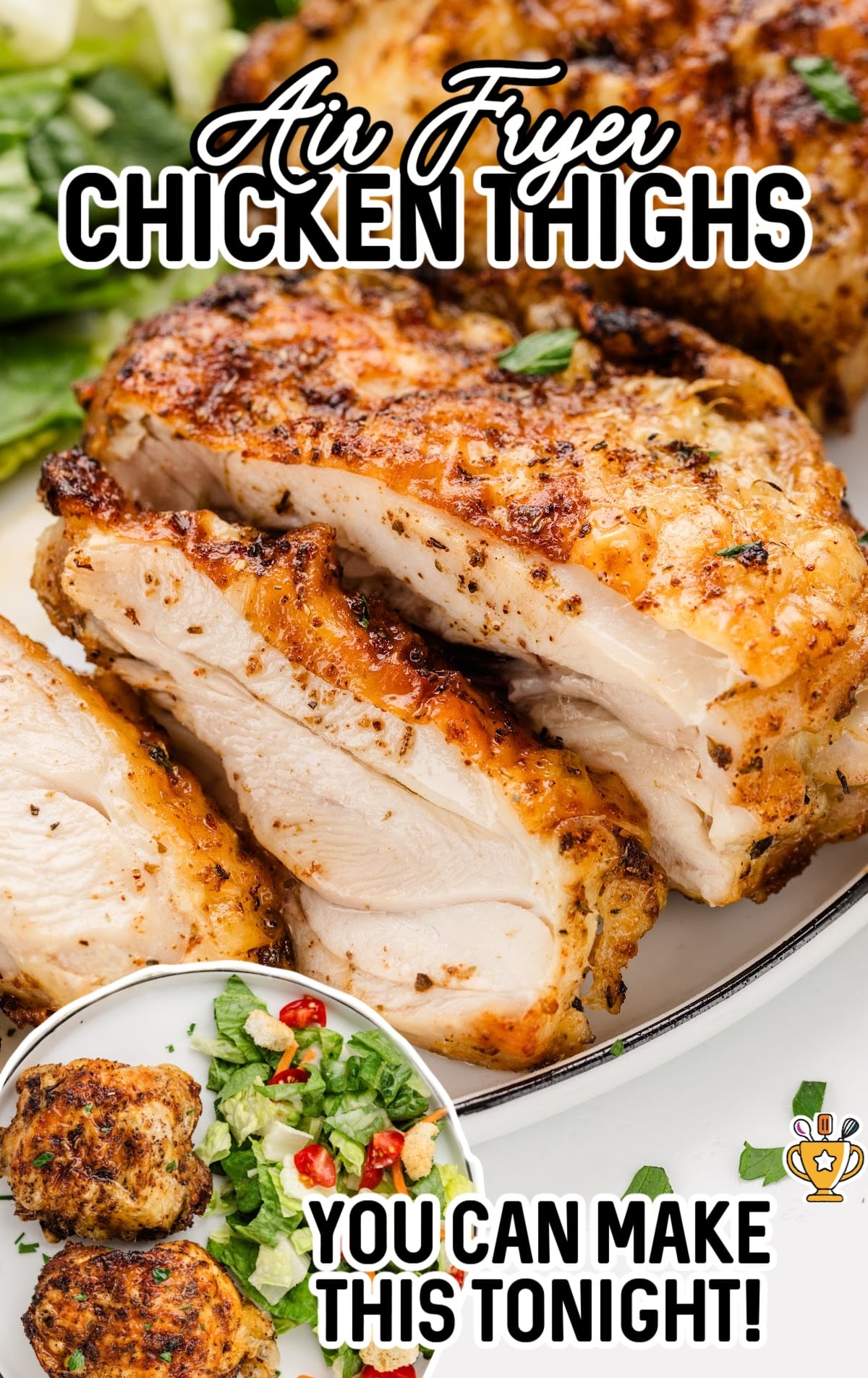 Air Fryer Chicken Thighs sliced on a dinner plate with a salad.