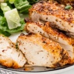 Air Fryer Chicken Thighs on a plate, sliced.