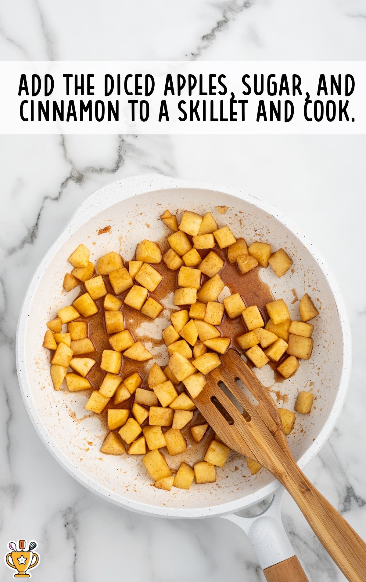 diced apples, sugar and cinnamon in a skillet with a wooden spoon