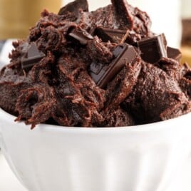 A white dessert bowl full of brownie batter.