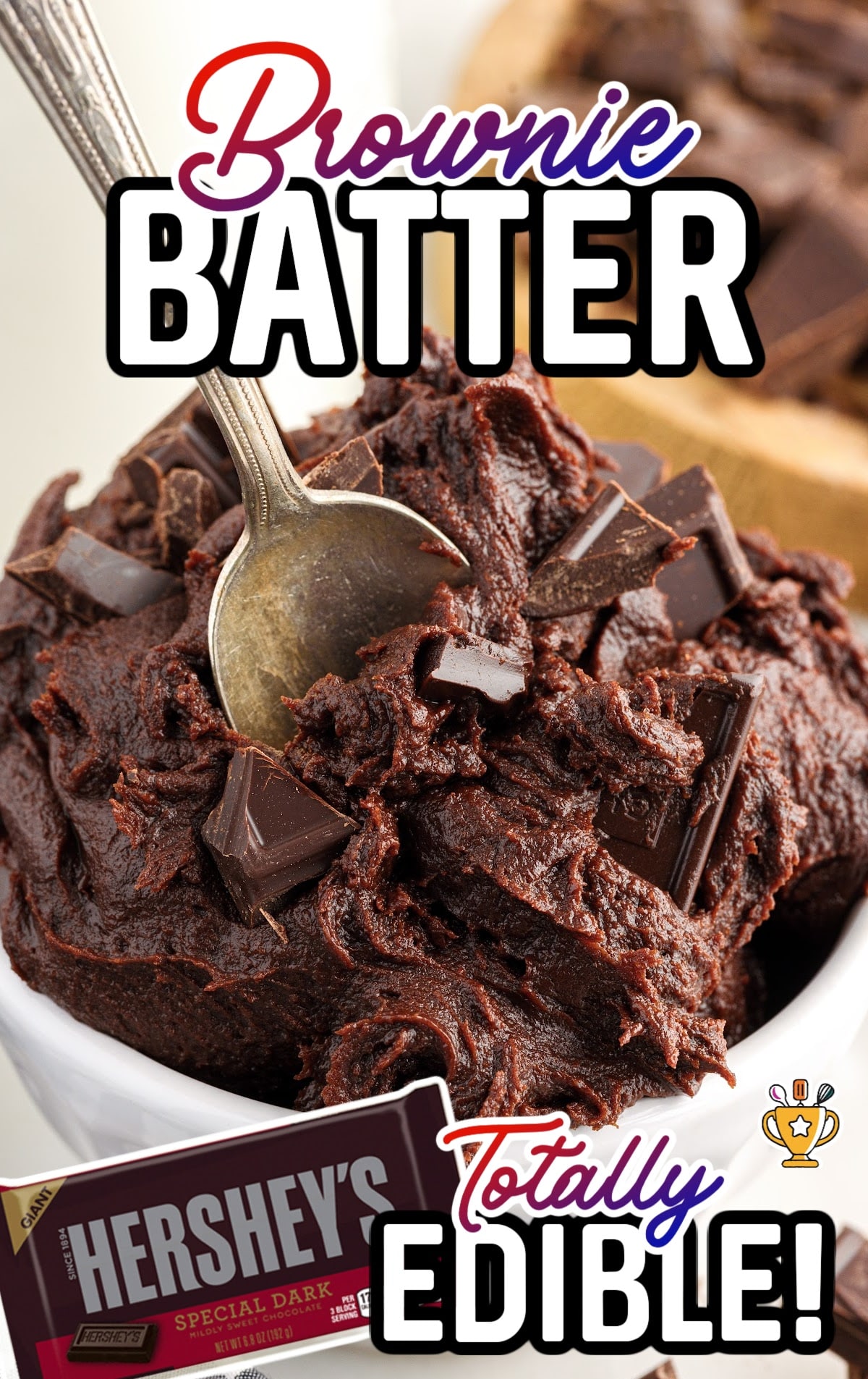 A bowl of brownie batter with a spoon in it.