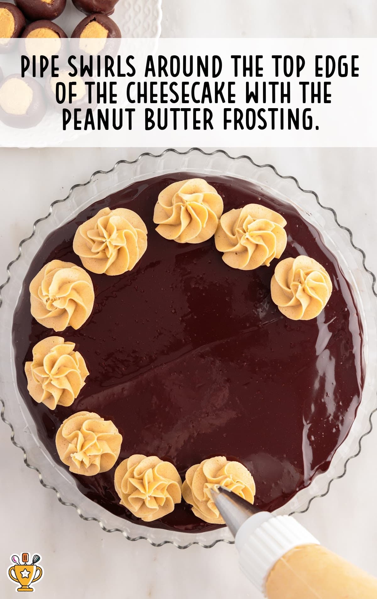 A pipe decorating a Buckeye Cheesecake
