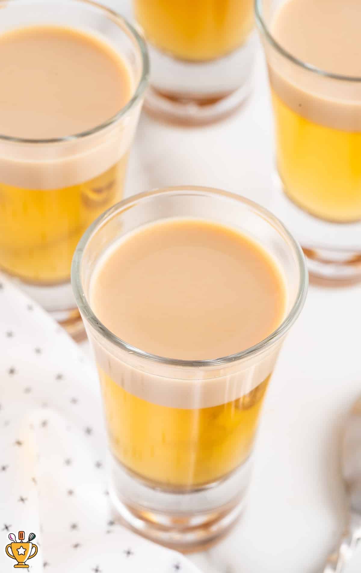 A photo of glasses of Buttery Nipple Shot from above