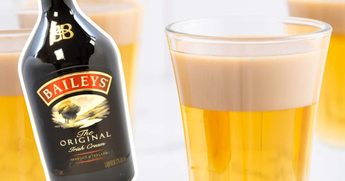 A bottle of Baileys and a glass of Buttery Nipple Shot
