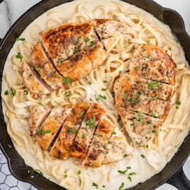 A skillet of chicken alfredo