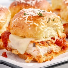 A plate of chicken parmesan sliders.