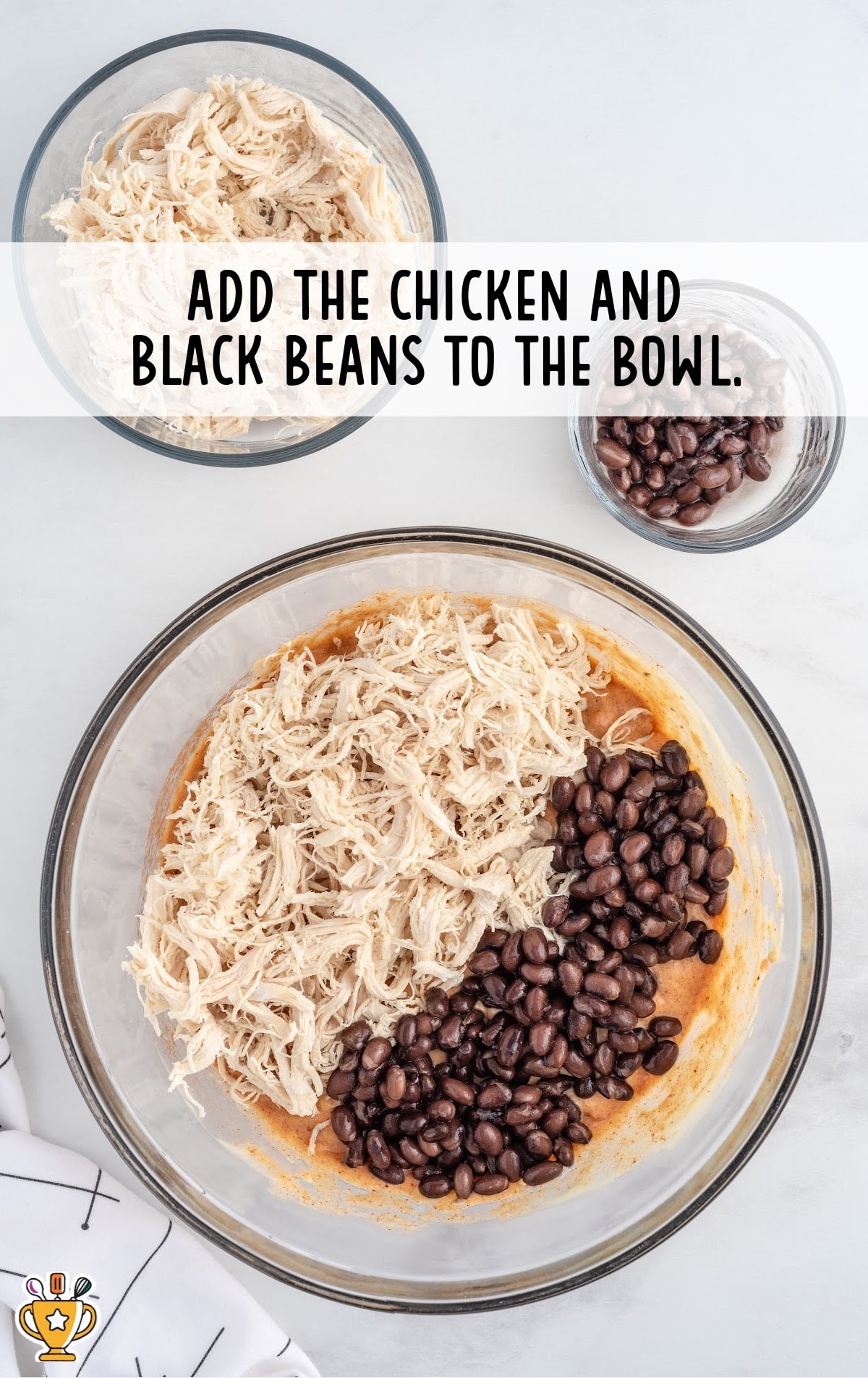 chicken and black beans added into the bowl