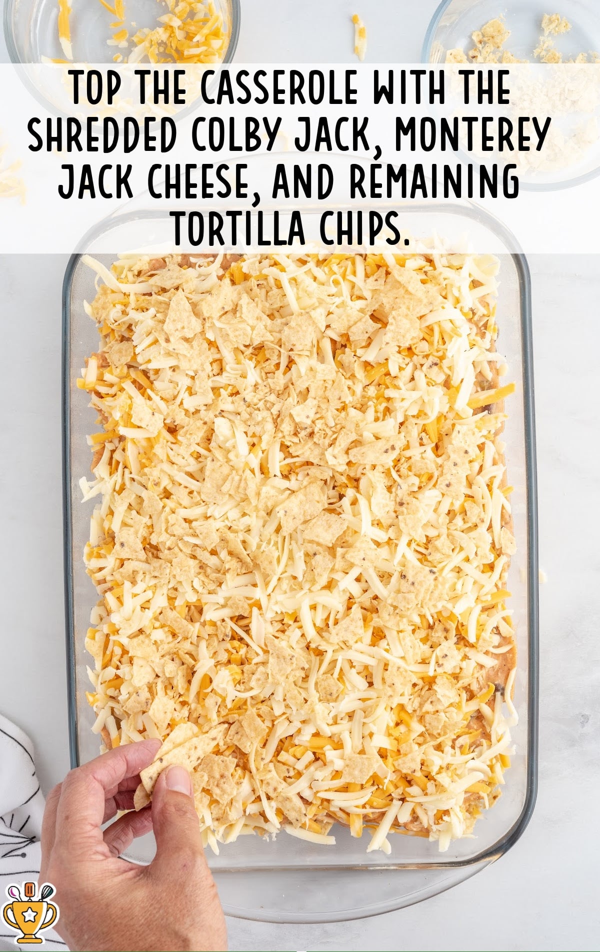 casserole topped with shredded colby jack, monterey jack cheese and tortilla chips