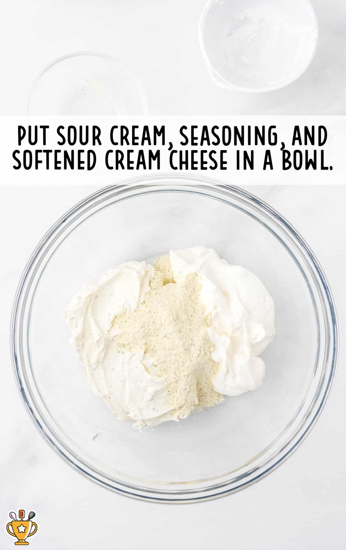 sour cream, seasoning and cream cheese in a bowl