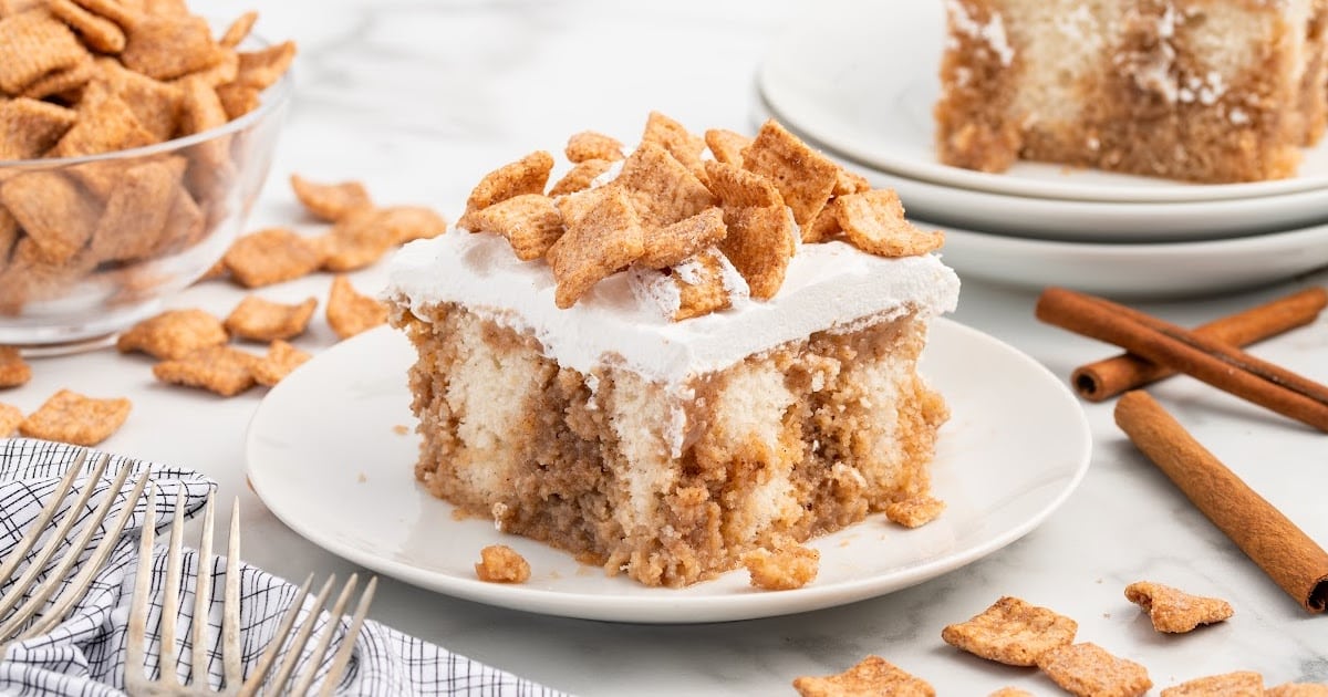 A piece of Cinnamon Toast Crunch Poke Cake