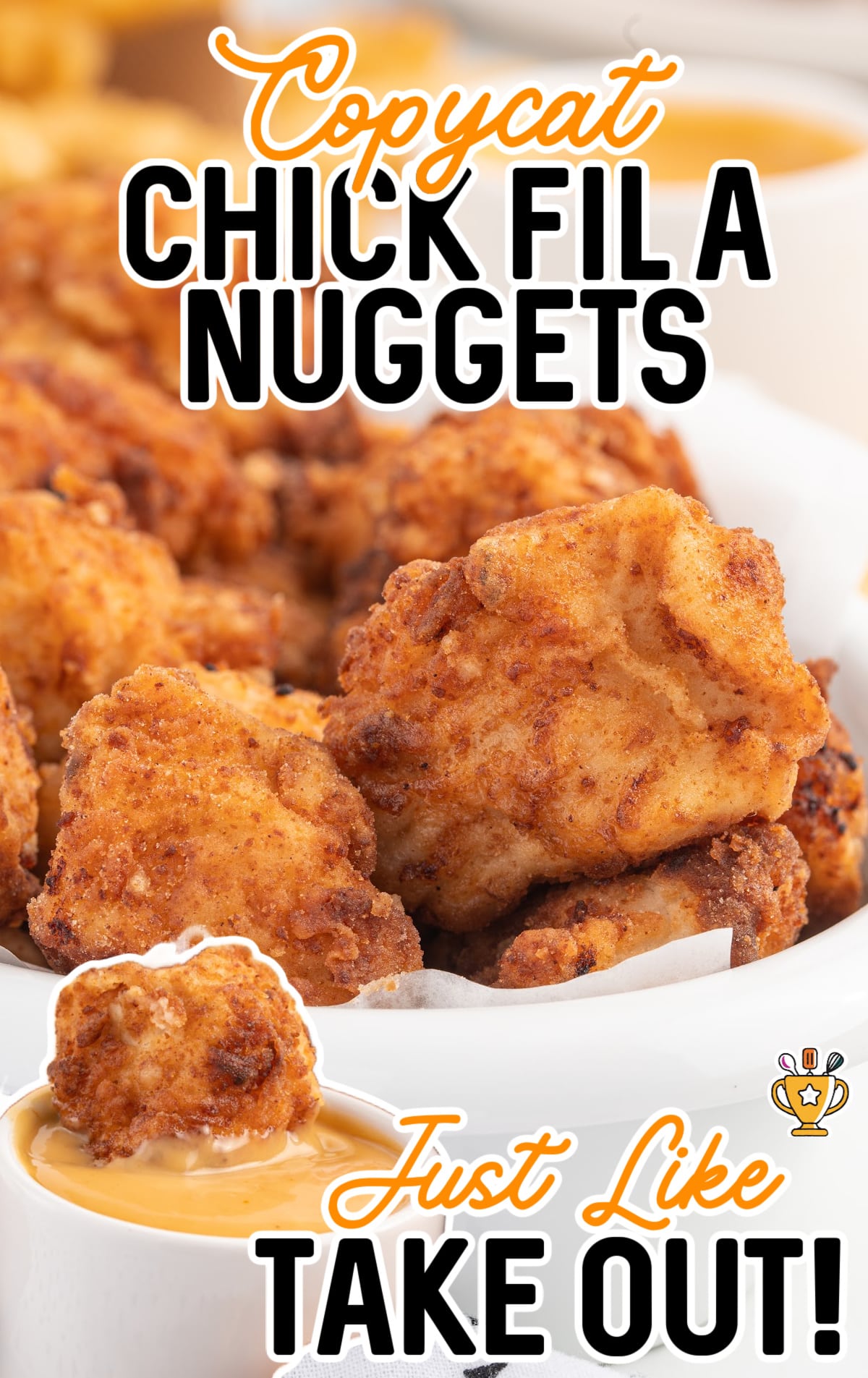 A bowl of chick fil a nuggets and a nugget dipped in copycat chick fil a sauce.