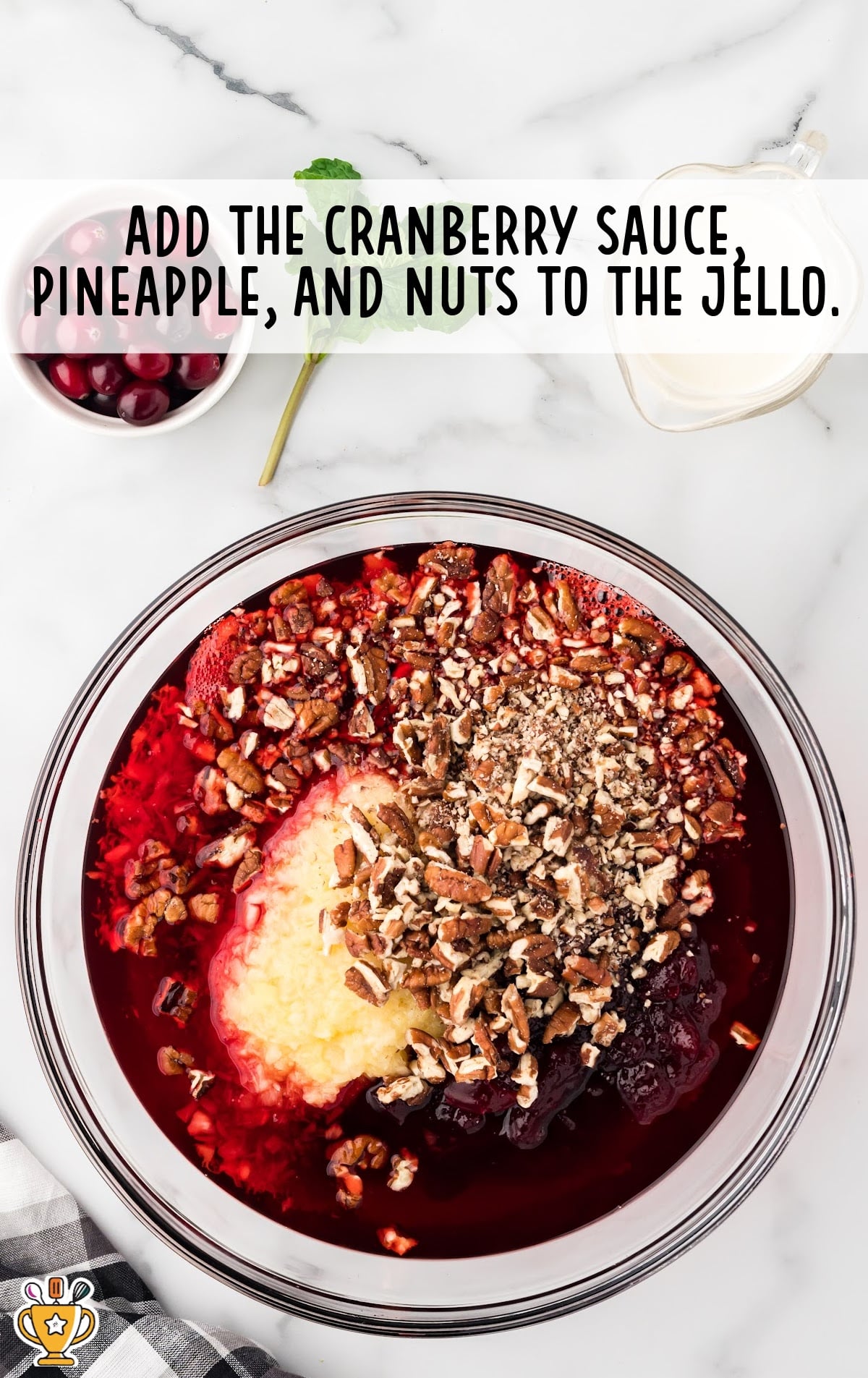 cranberry sauce, pineapple and nuts added to the jello in a glass