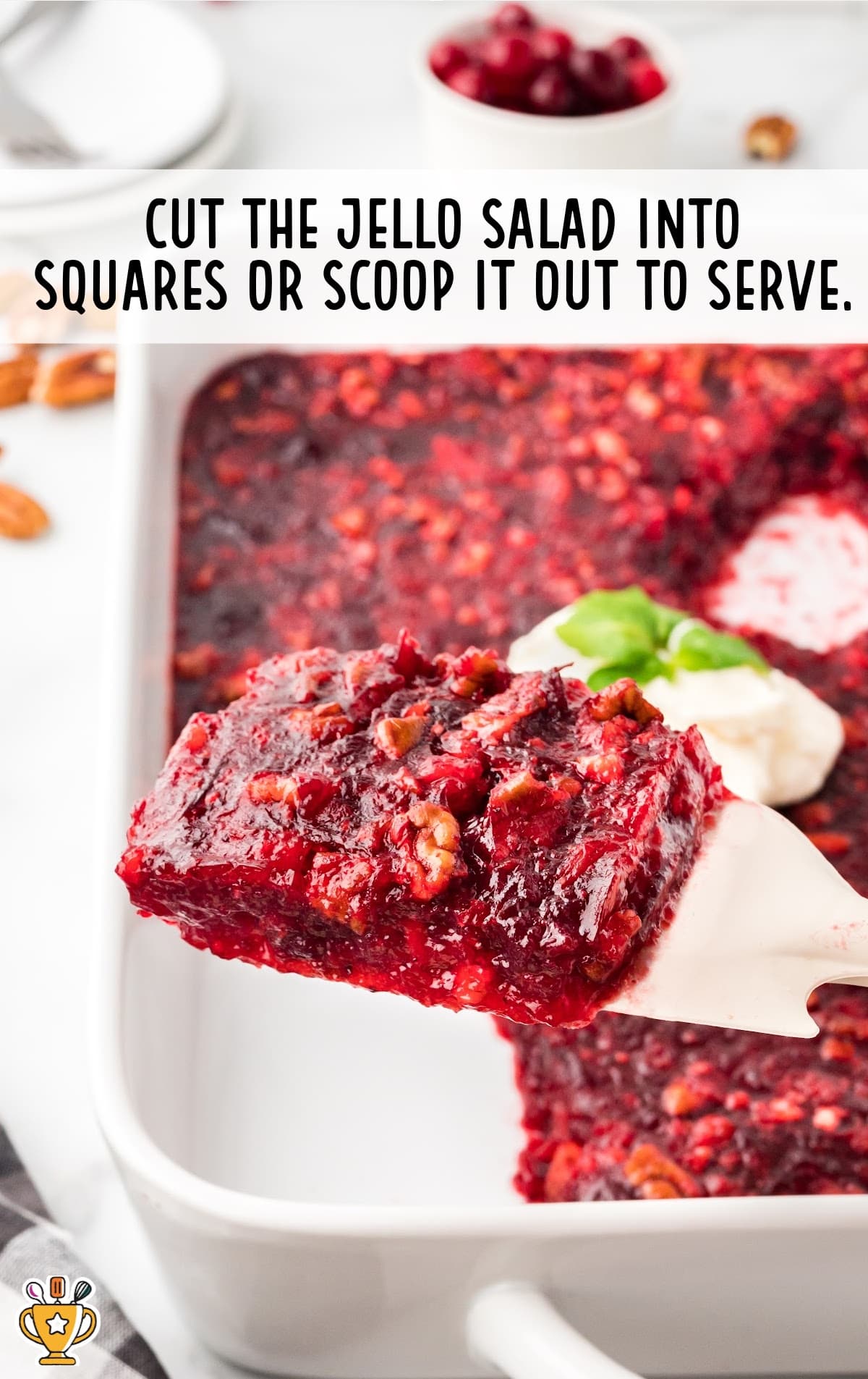 scooping a piece of jello salad out of the dish