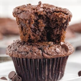 Two Double Chocolate Chip Muffins, one on top of the other on a plate