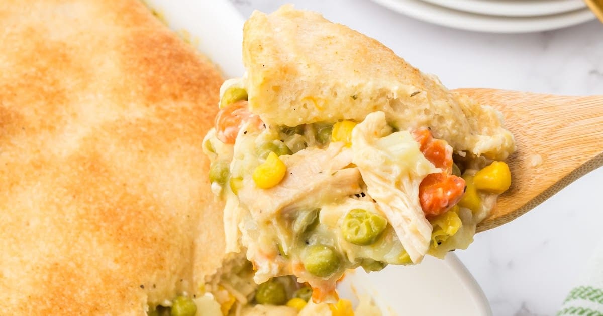 a wooden spoon lifting out of potion of Easy Chicken Pot Pie