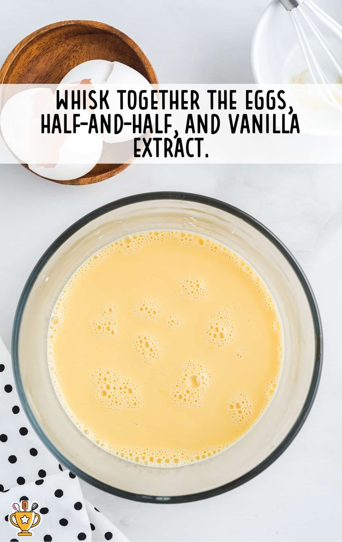 a mixture of eggs, half and half, and vanilla extract in a bowl