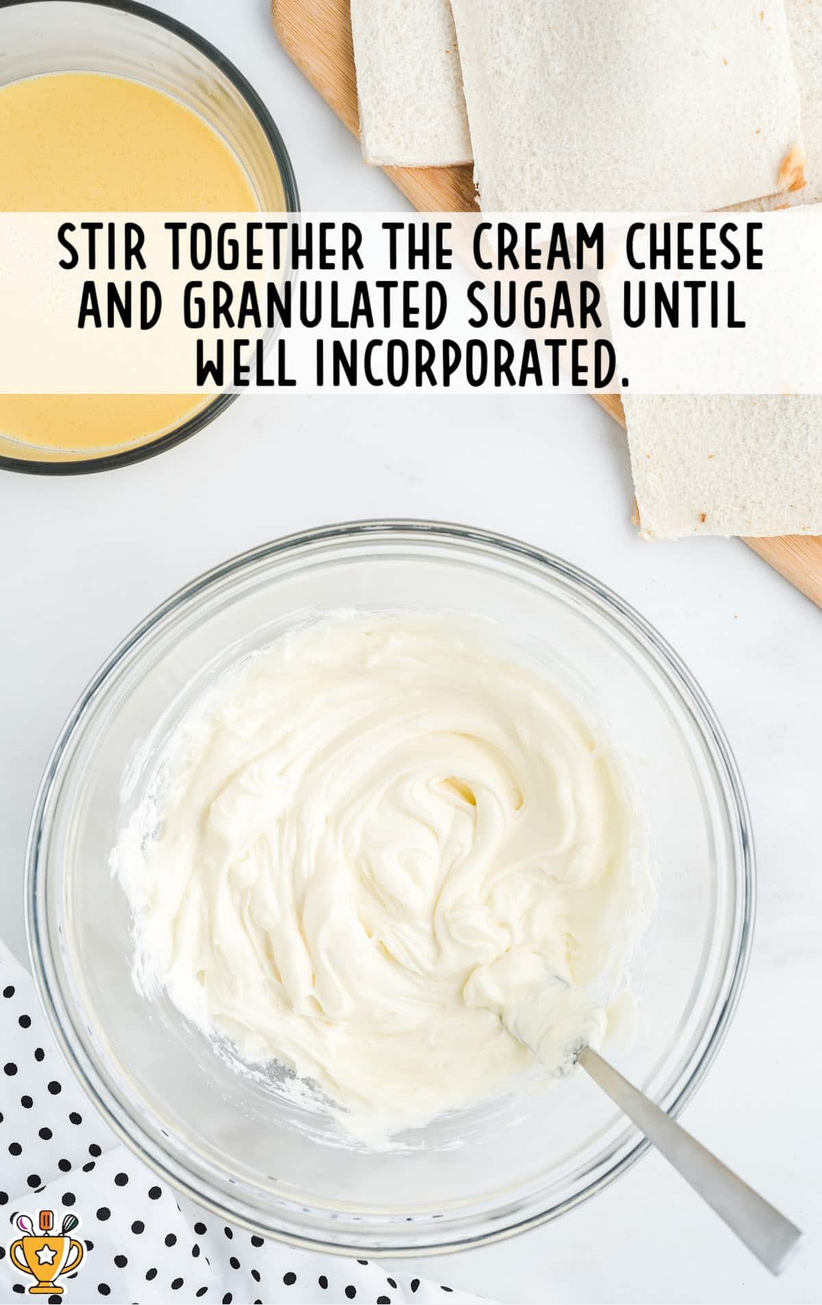 cream cheese and sugar stirred together in a glass bowl