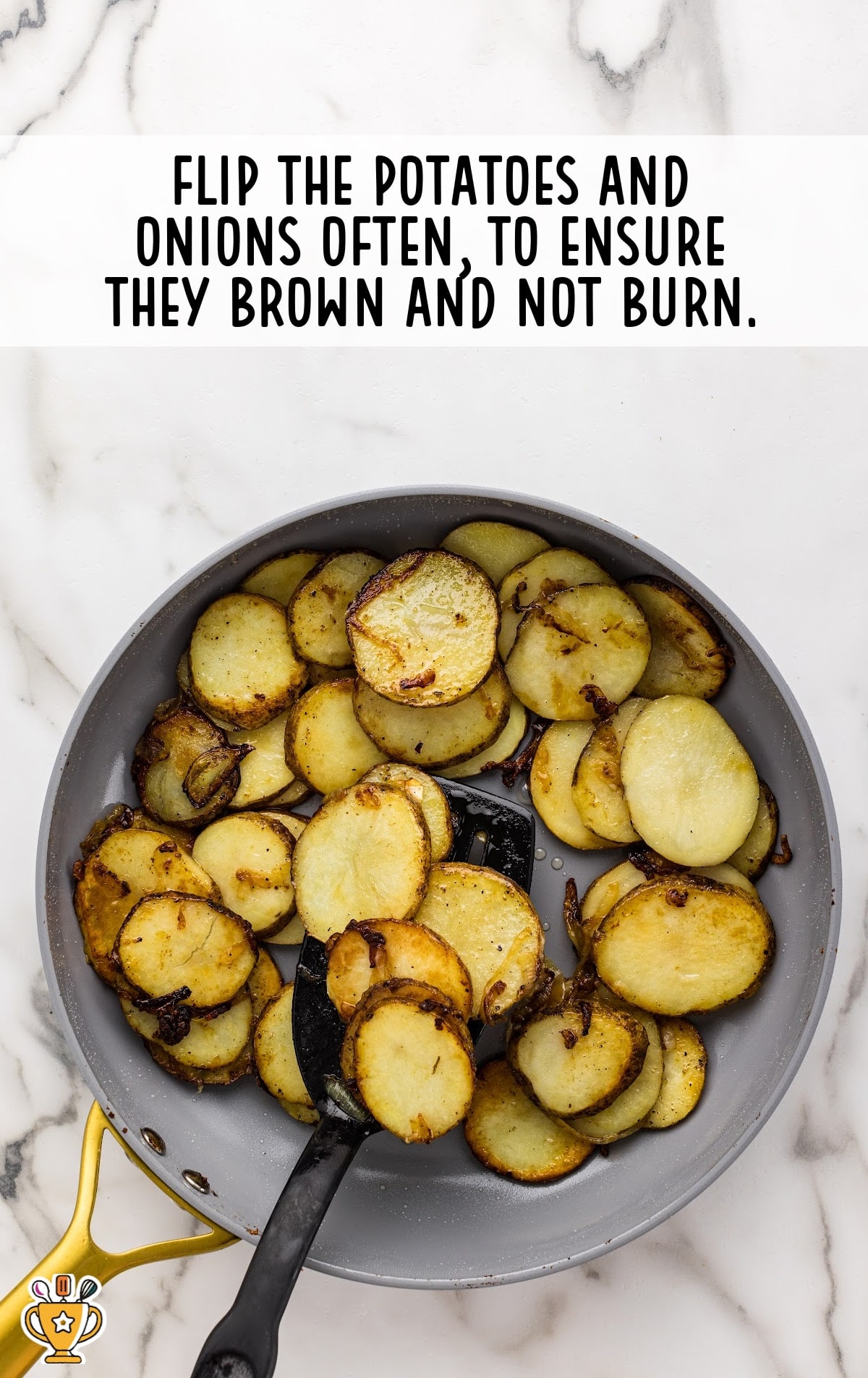 flipping the onions and potatoes in a frying pan