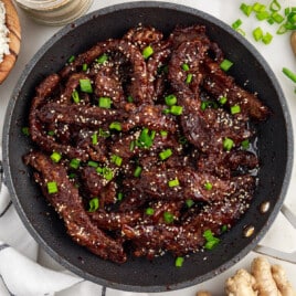 A pan of cooked ginger beef.