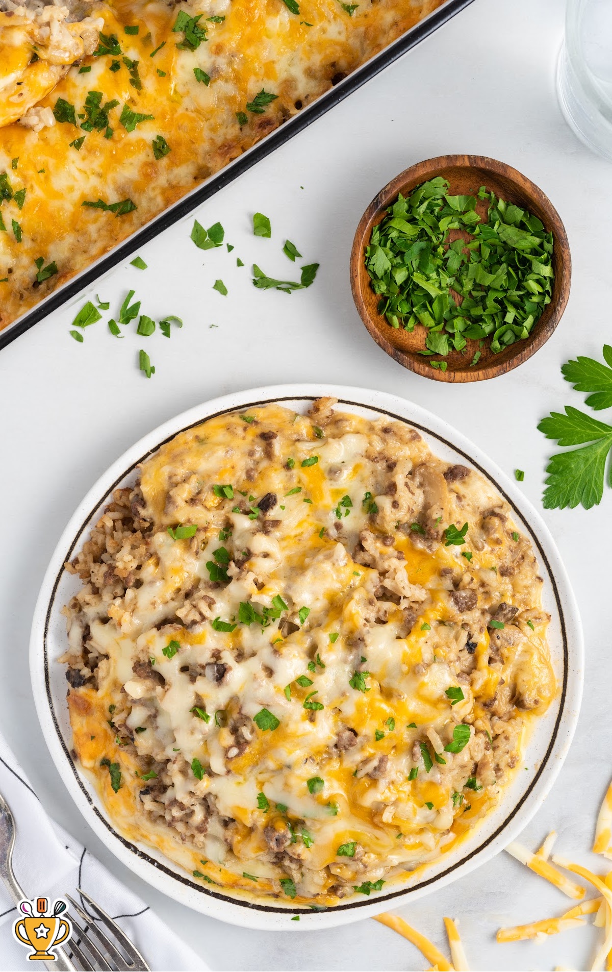 a white plate covered in a serving of Hamburger Rice Casserole