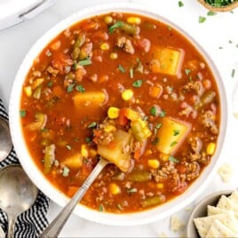 Hamburger Soup Crockpot in a white bowl with a spoon