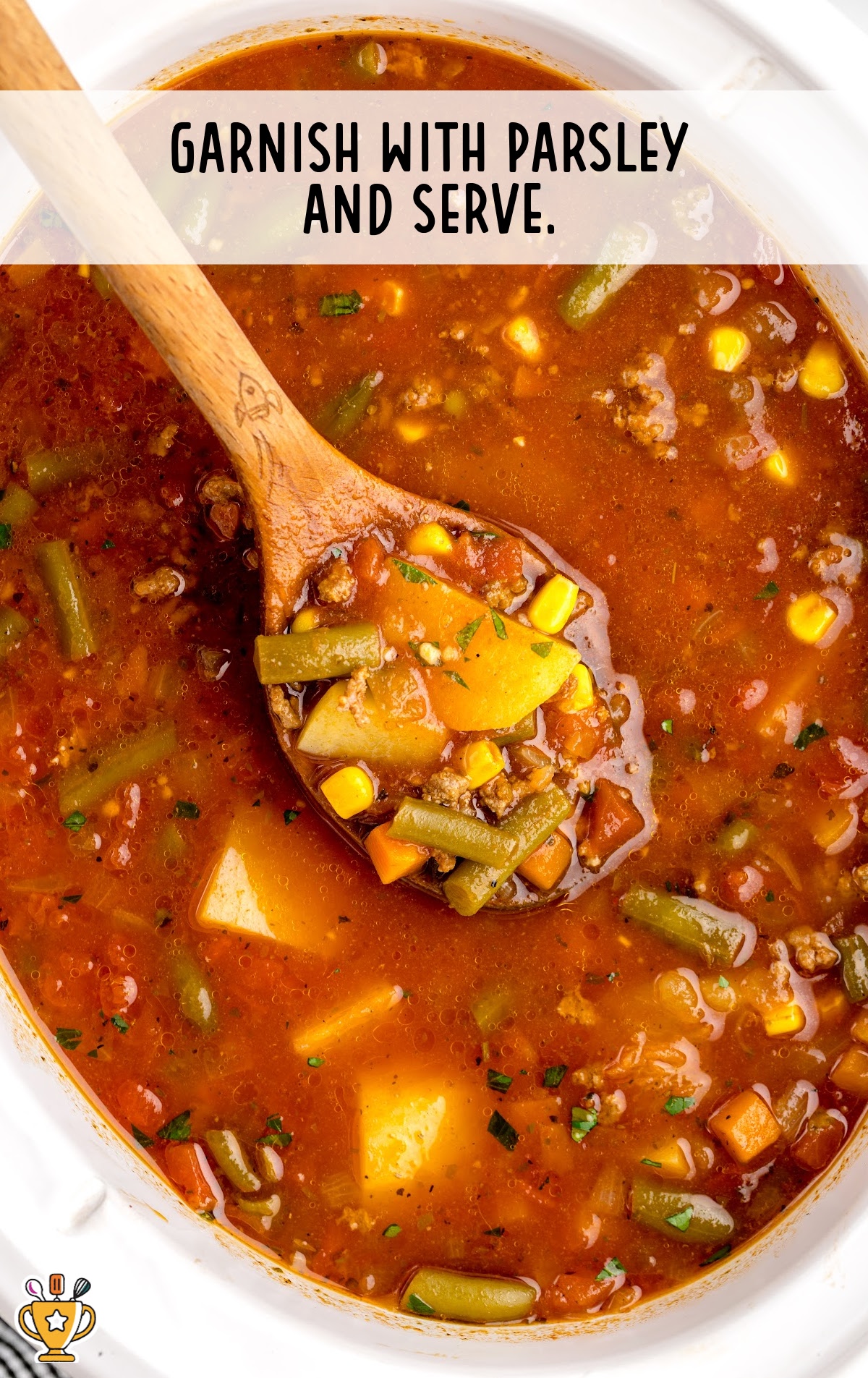 Hamburger Soup Crockpot in pot with a wooden spoon
