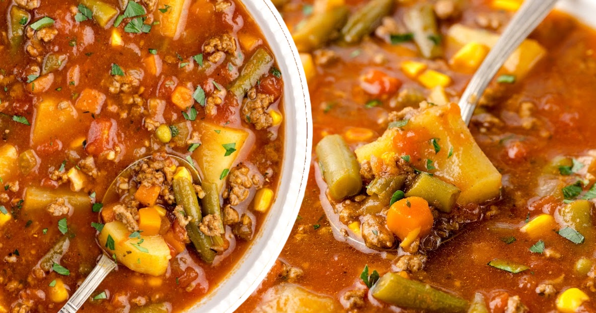 A closeup photo of Hamburger Soup Crockpot in bowls, with two spoons holding some soup