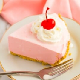 A slice of strawberry jello pie.